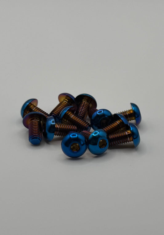 Collection of small blue screws on a gray background