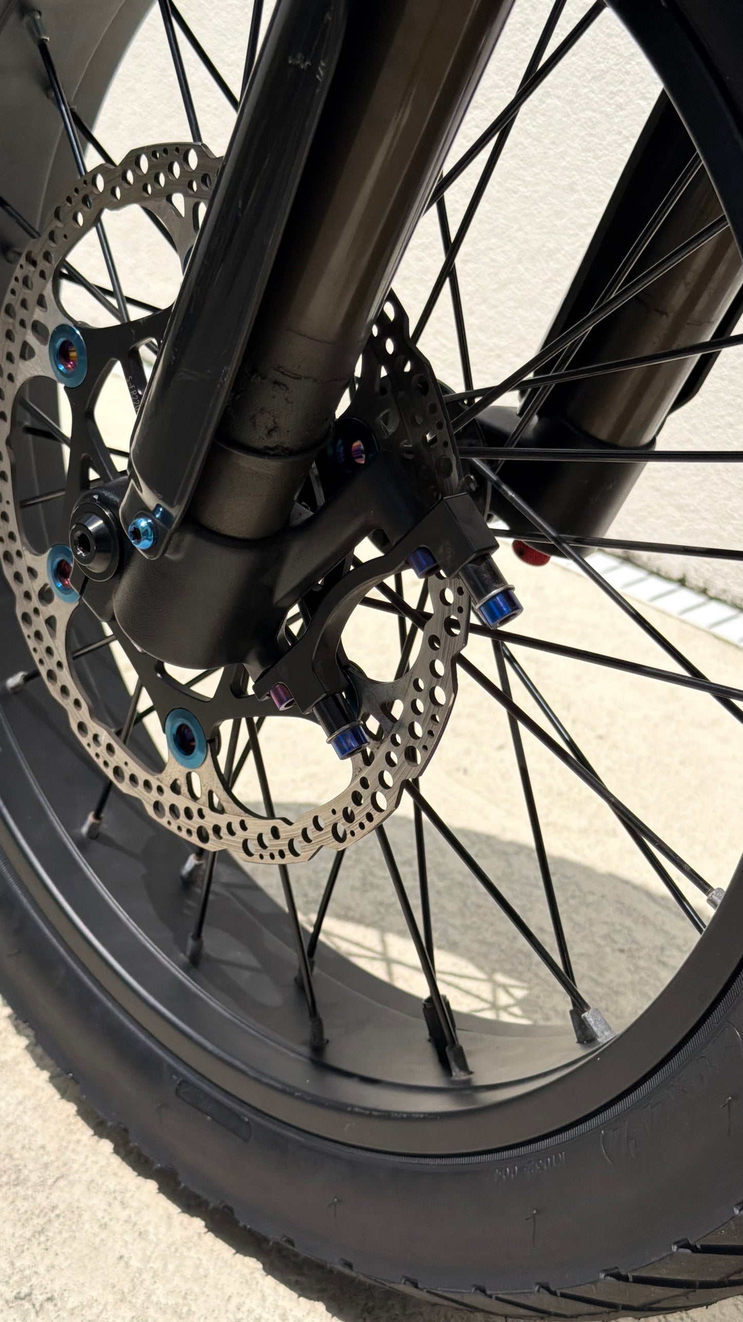 Close-up of a bicycle wheel with disc brake system