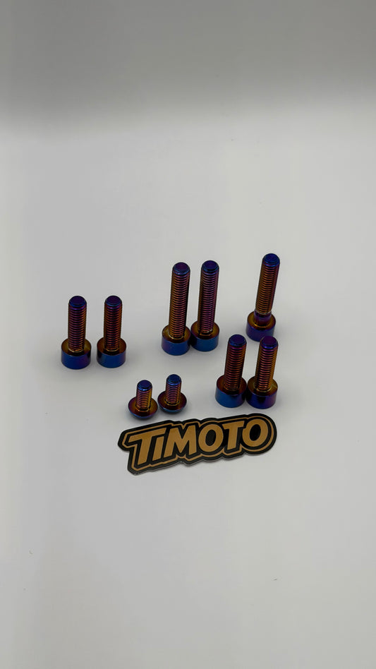 Set of metal bolts with blue and red coloring on a white background, featuring the 'TIMOTO' brand logo.